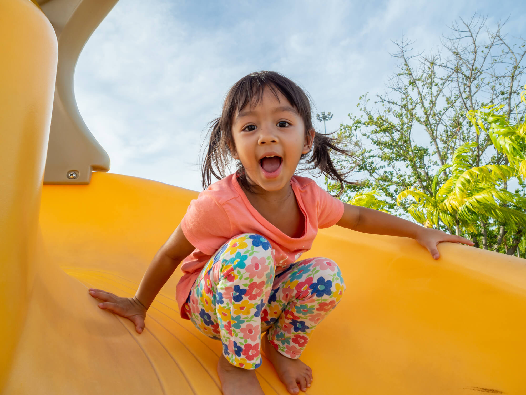 Child going down a slide.